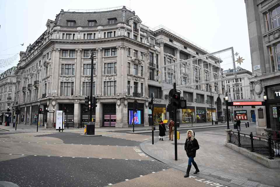 Oxford Street in London was deserted on New Year's Day - social distancing measures will remain in place until vaccines can trigger herd immunity