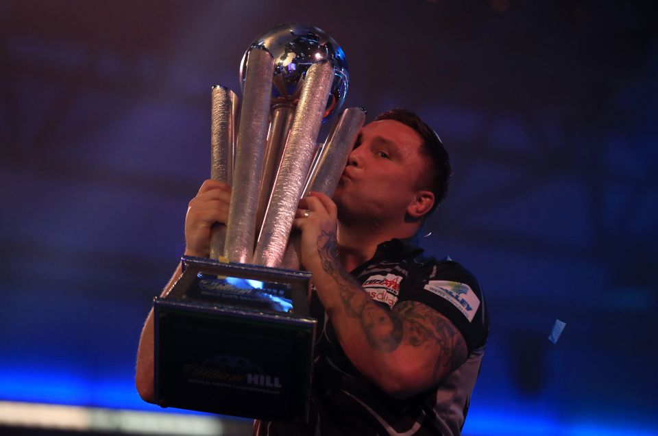 Gerwyn Price kisses the trophy after his 7-3 victory over Gary Anderson