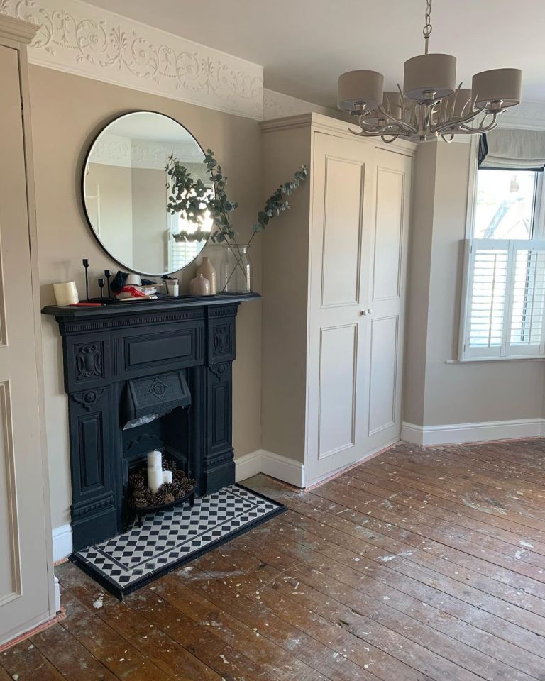 They spruced up the fireplace with some tiles to match the black and white colour palette 