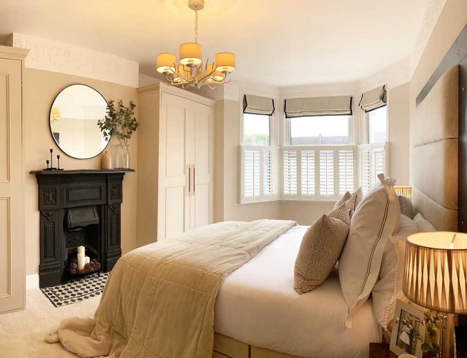 Their bedroom looks so modern and cosy and the couple made thier own roman blinds and headboard 