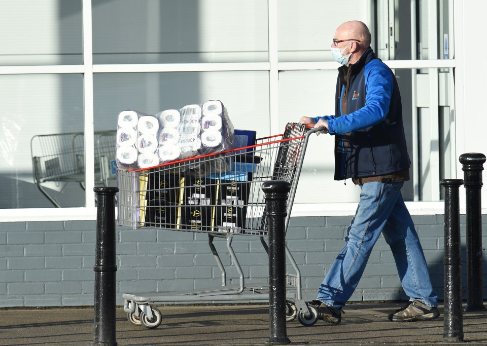 A man buying his essentials in bulk this morning in Manchester