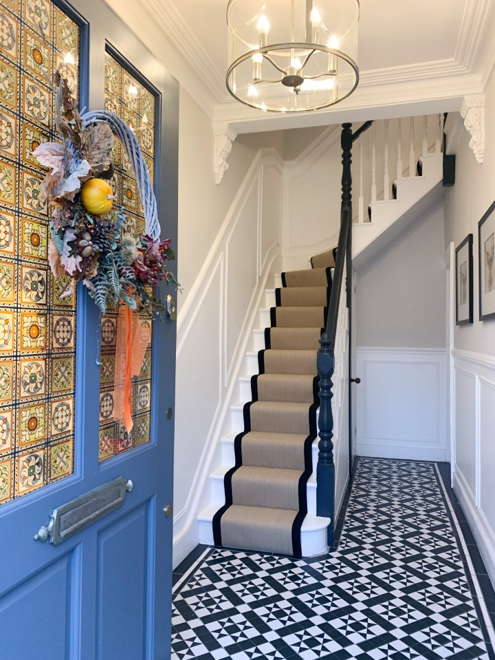 The stairs  and hallways were given a makeover with Victorian mosaic tiles 