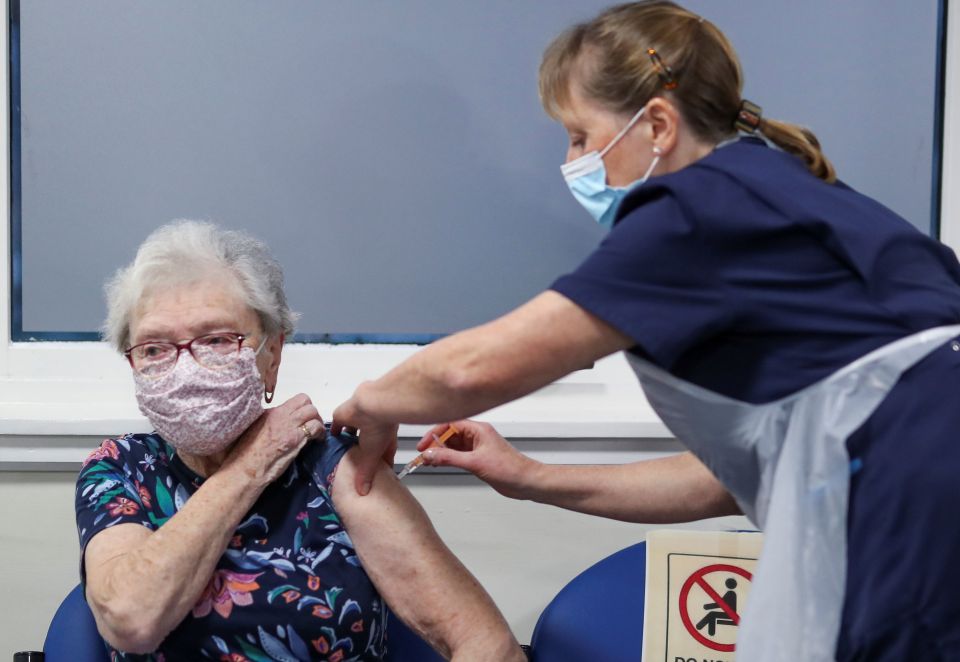 A patient receiving the Oxford/AstraZeneca coronavirus vaccine at the Pentlands Medical Centre in Edinburgh, Scotland