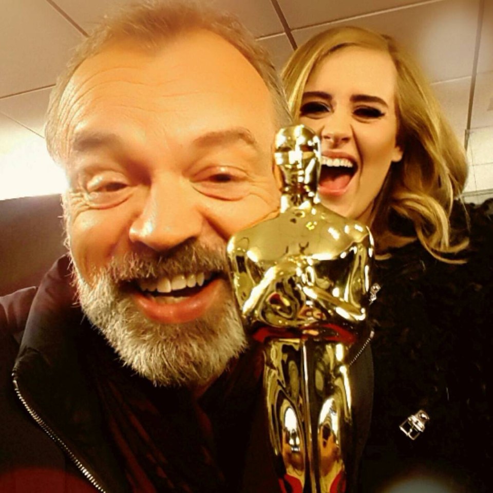 Graham poses with Adele and the Oscar she won in 2013