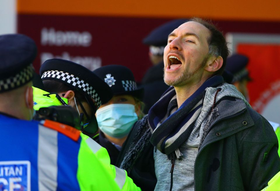 The man can be seen yelling during the protest