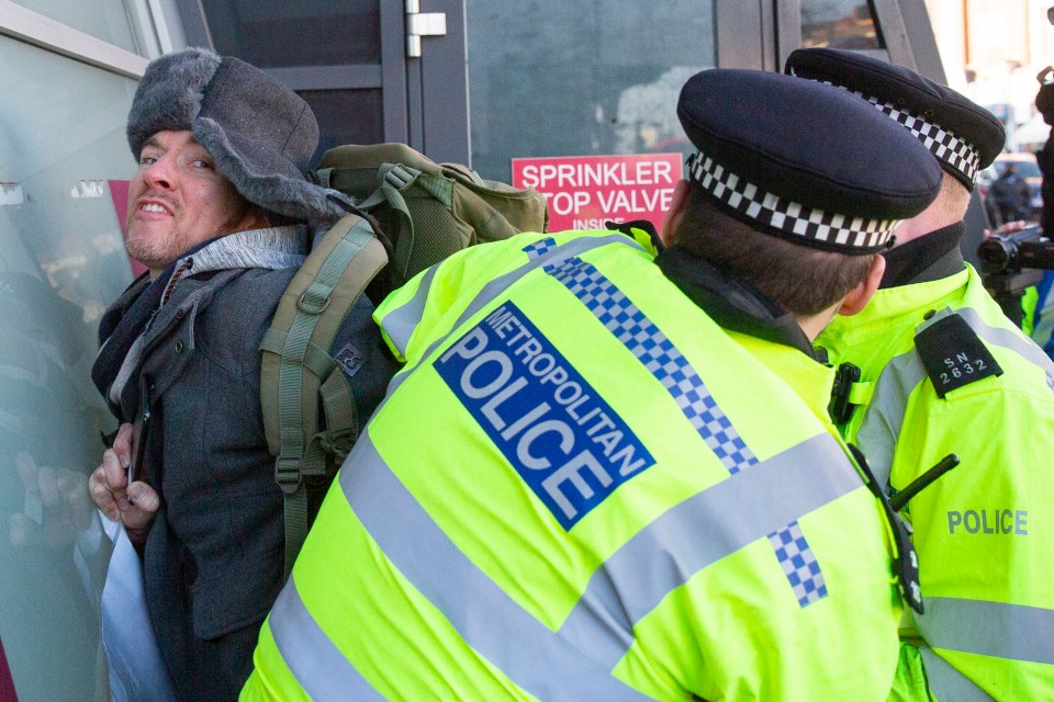 A protester is arrested during the anti-lockdown protests in London 