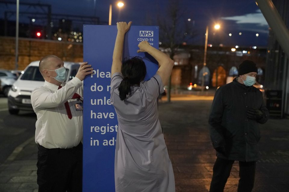 NHS staff are seen setting up in Newcastle this morning as they prepare to roll out the jab