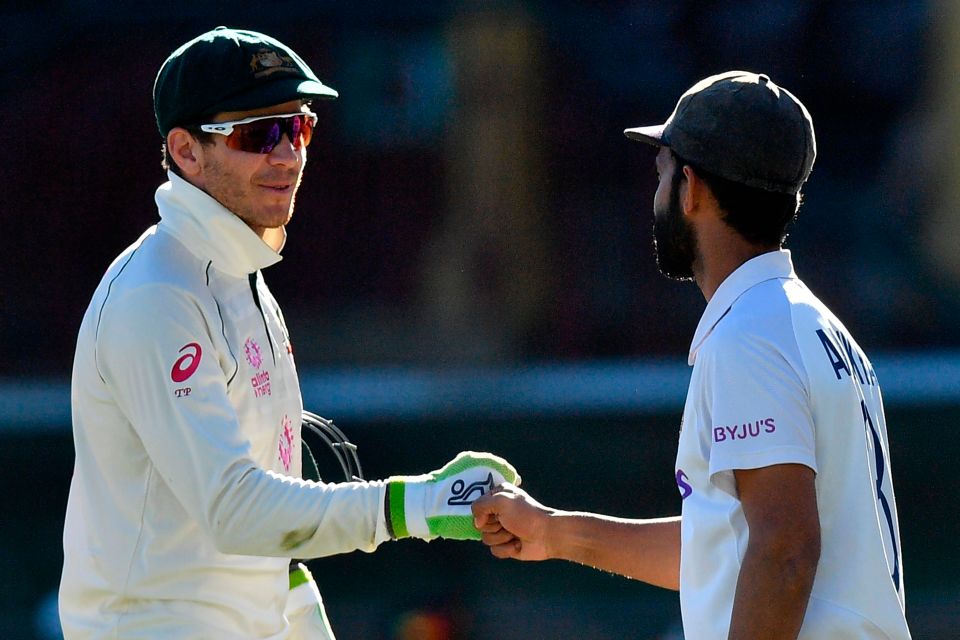 Paine fist bumps India's stand-in captain Ajinkya Rahane