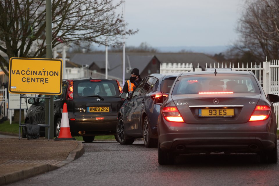 Cars are seen lining up at the vaccine centre in Surrey this morning 