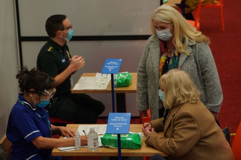 Patients in Newcastle are seen discussing the vaccine before receiving the jab