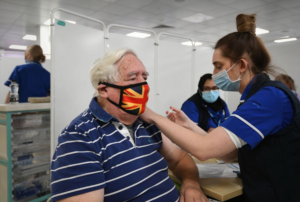 Robert Williams, 84, receives an injection of a Covid-19 vaccine at the NHS vaccine centre that has been set up at Robertson House in Stevenage