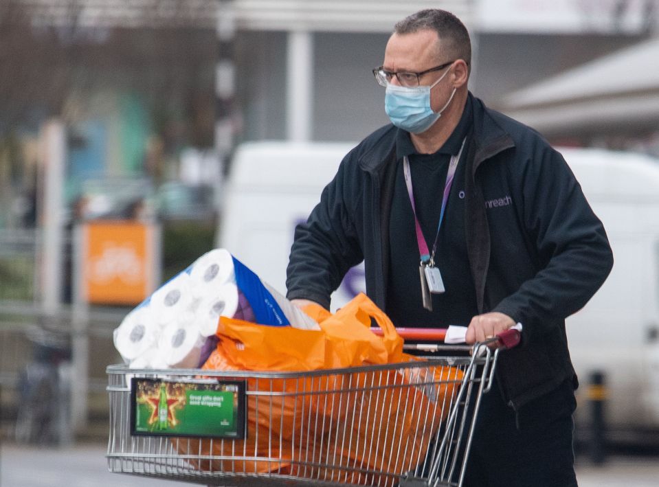 Supermarkets are clamping down on face-mask wearing. Pictured: A shopper at Sainsbury's