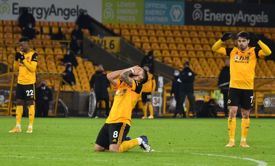 Ruben Neves and the Wolves players react after his late effort hit the bar