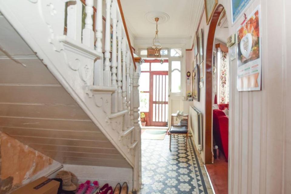 The Edwardian house still has some of its original features - like this staircase