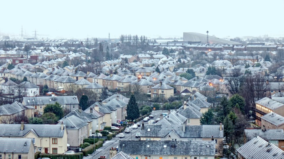 Rooftops were topped with snow the morning in Glasgow