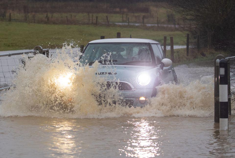 Heavy rain elsewhere left cars battling floodwater in Leicester