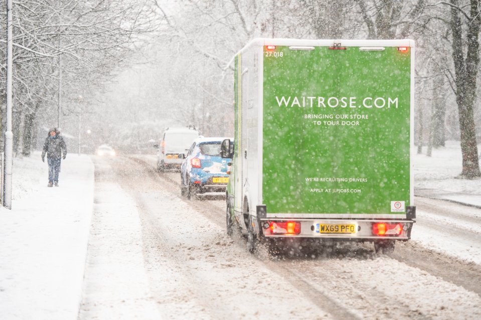 A Waitrose van tries to deliver food in the snowy blast in Leeds