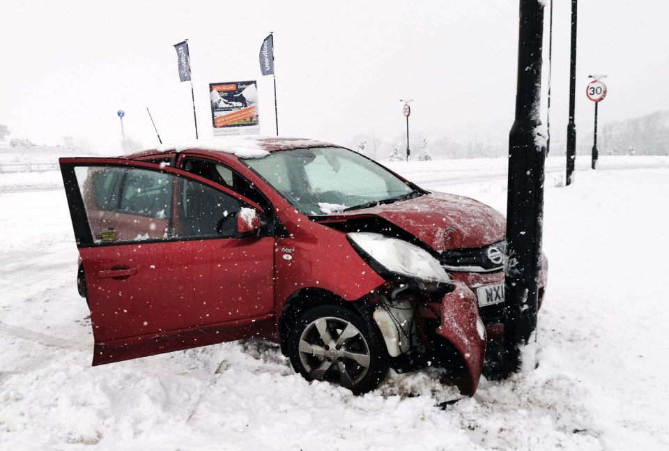 A smashed up car was seen in Leeds as the weather caused traffic chaos