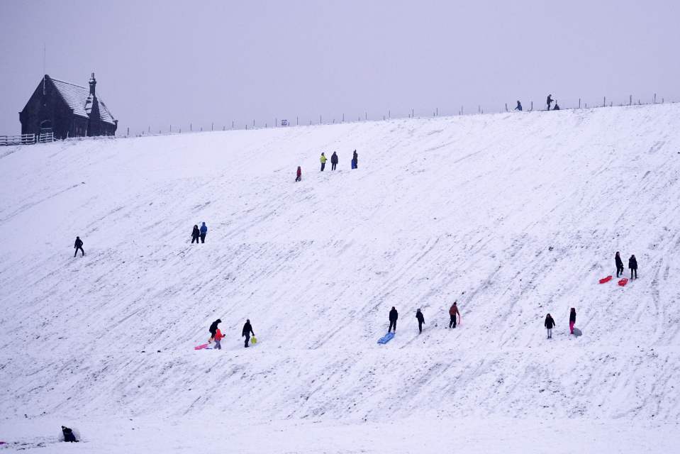 Some made the most of the cold blast with a sledge down the hillside at Butterley Reservoir in Marsden