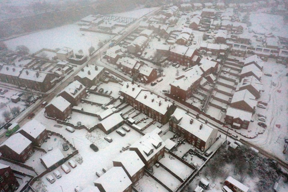 Snow-covered roofs in East Ardsley, West Yorkshire