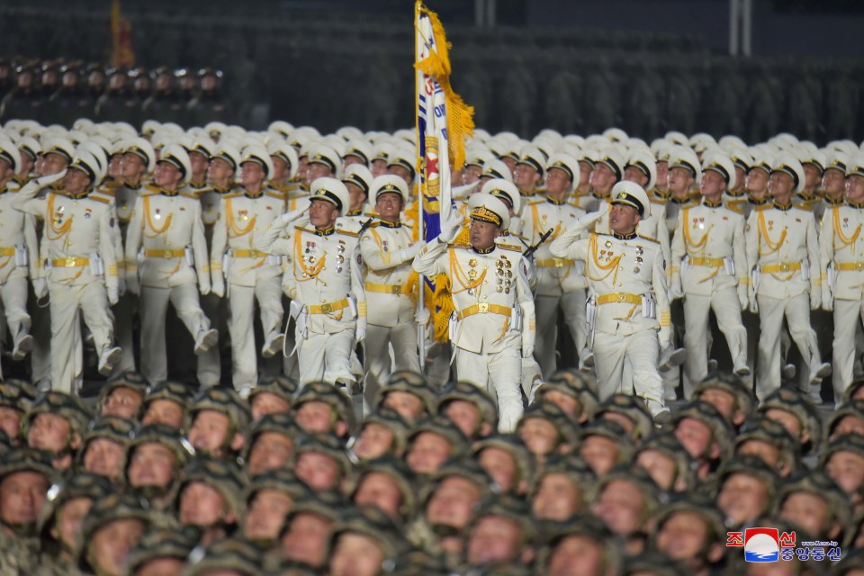 Soldiers salute the leader in Pyongyang last night