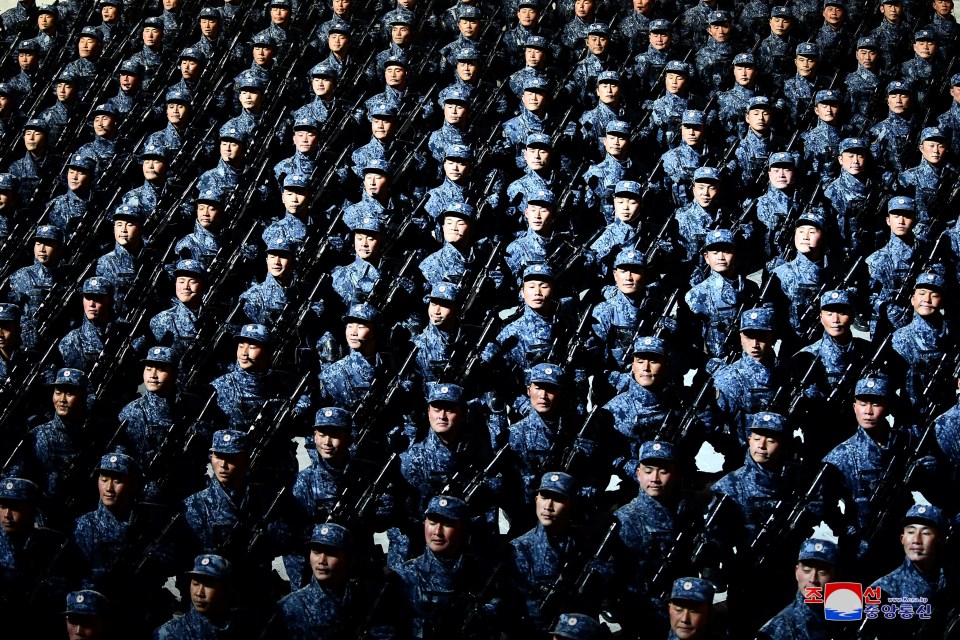 Ranks of goose-stepping soldiers paraded through the capital