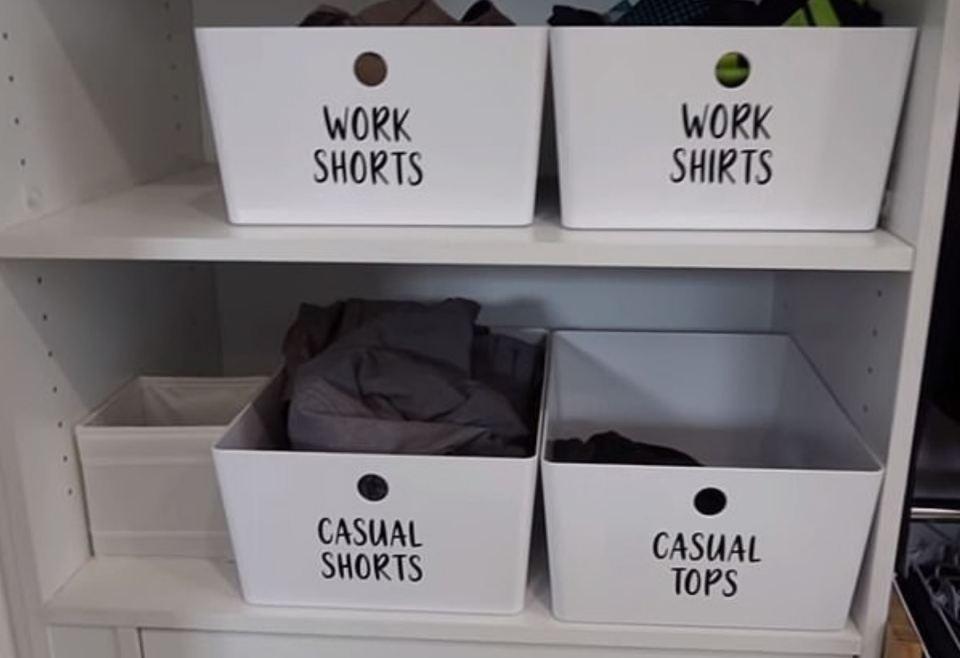 She sorts her husband's wardrobe into labelled tubs