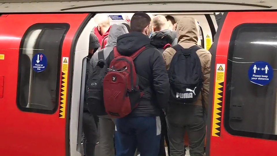 Brits piled into carriages at Canning Town this morning