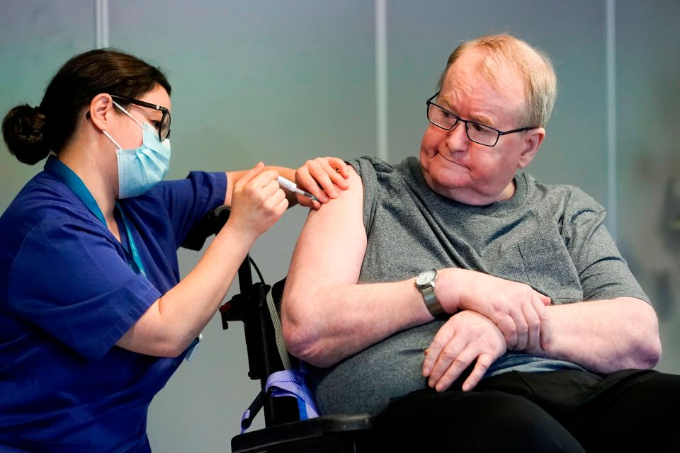 Svein Andersen, 67, receives the Pfizer-BioNTech Covid-19 vaccine in Oslo