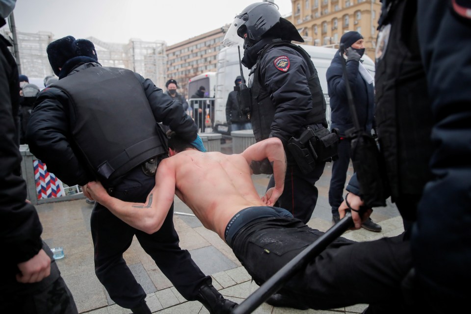 One protester being dragged away by cops