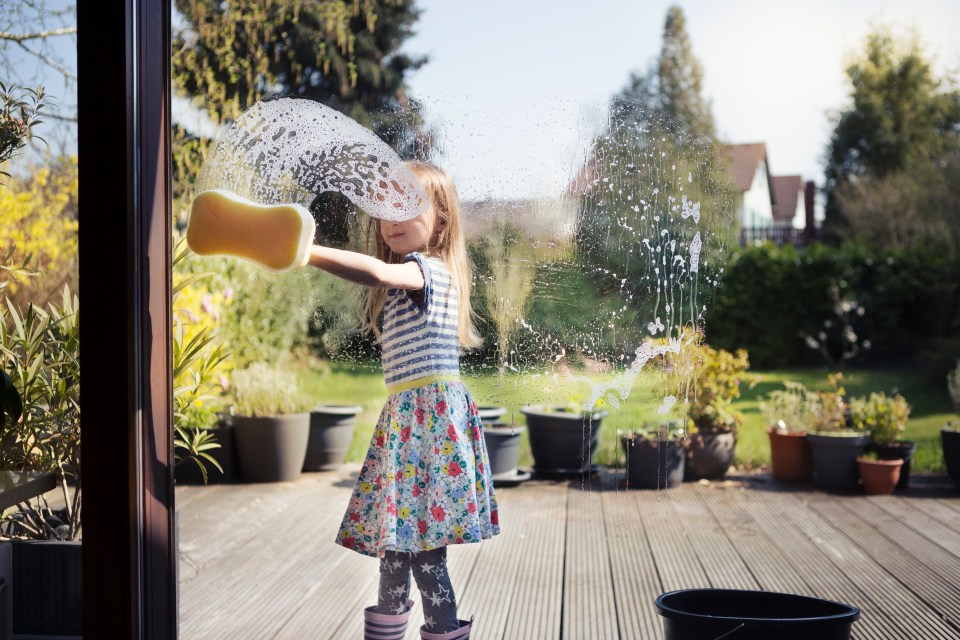 According to this bonkers guide, four-year-old should be disinfecting doorknobs and putting away dishes