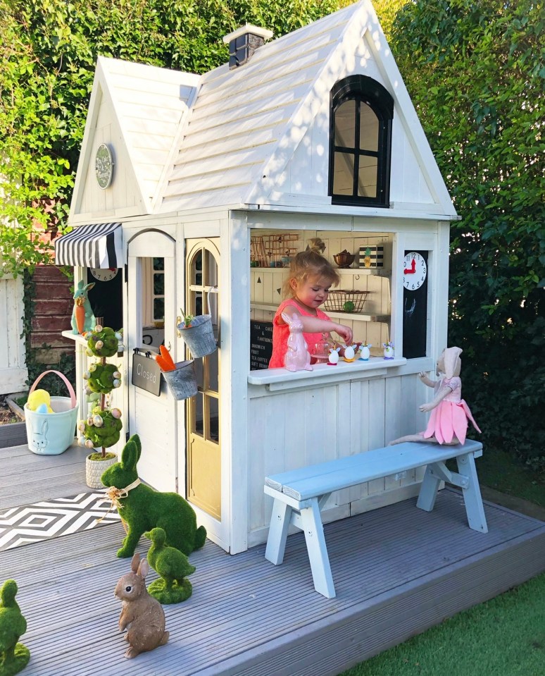 The girls have two playhouses in the garden - one of which Lucy turned into a cafe