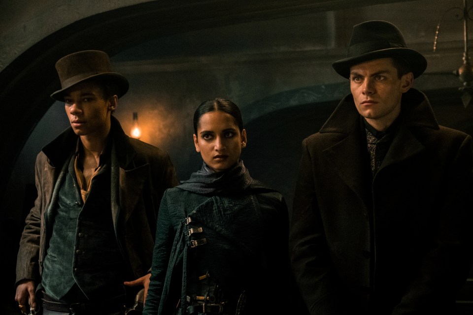 Kit Young as Jesper Fahey, Amita Suman as Inej Ghafa and Freddy Carter as Kaz Brekker