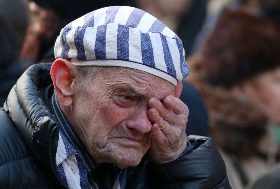 A survivor of the camp pay his respects to those murdered at the site 