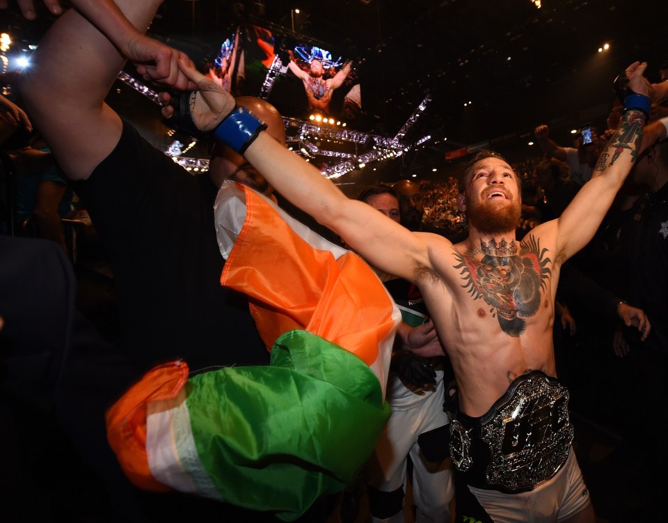 McGregor celebrates after defeating Chad Mendes in the second round of their Interim UFC Featherweight Championship Title bout