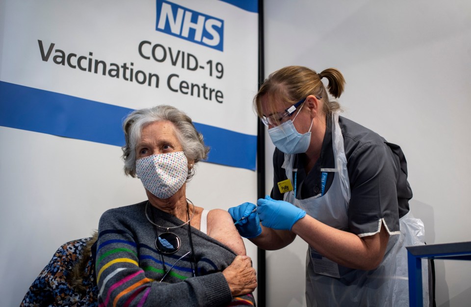 Dr Doreen Brown, 85, receiving a Covid vaccine jabs at Guy's Hospital in London, one of hundreds of vaccination centres around the country