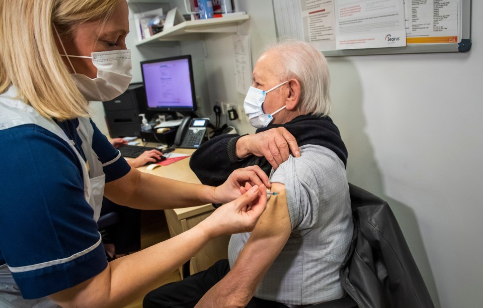 Nurse Lisa Snowden injects a patient with the Pfizer Covid vaccine at the Royal Health & Wellbeing Centre on January 11