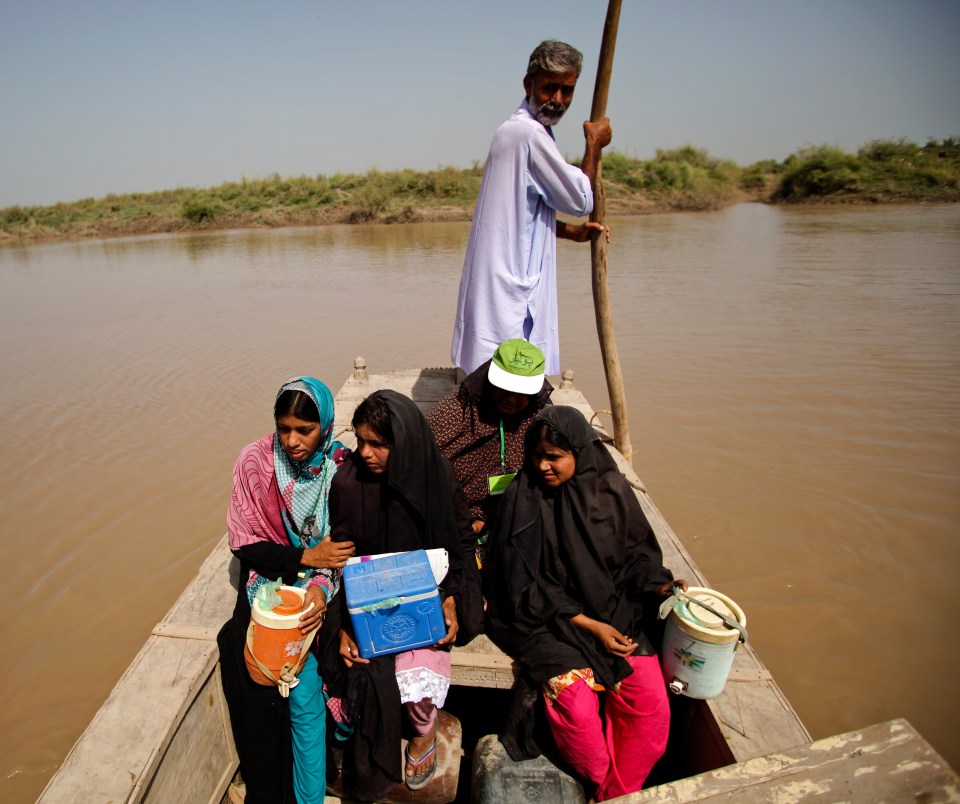 Polio teams crossed Indus river on a boat to vaccinate young children in village shah Nawaz, UC Mirzapur, Shikarpur district of Sindh province in Pakistan in 2012