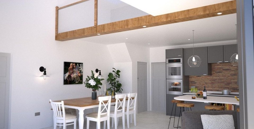 The bright kitchen has wooden beams and statement walls