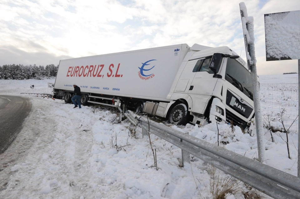 An HGV lorry lies overturned on the A68 in Otterburn, Northumberland