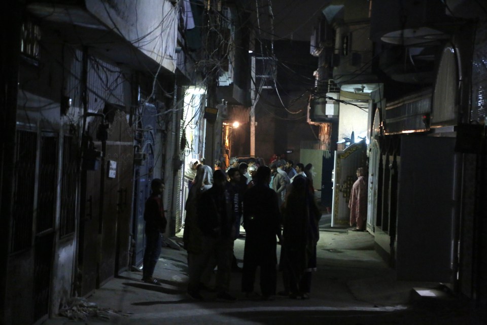 Pictures show families pouring out onto the street in the aftermath of the quake