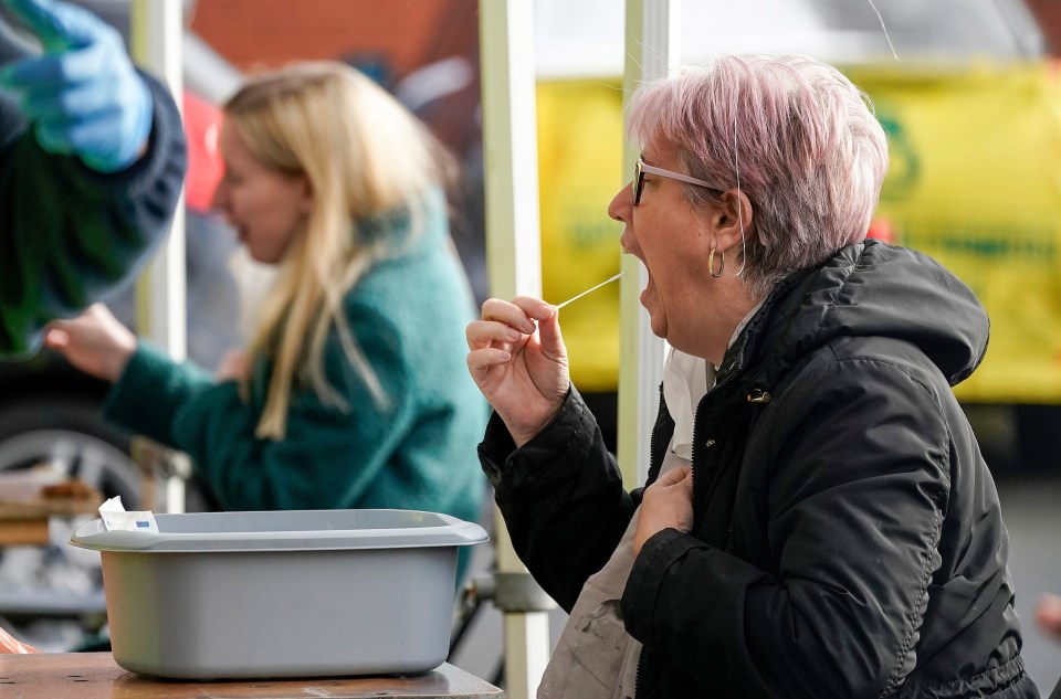 A testing site in Manchester as a woman takes a swab test