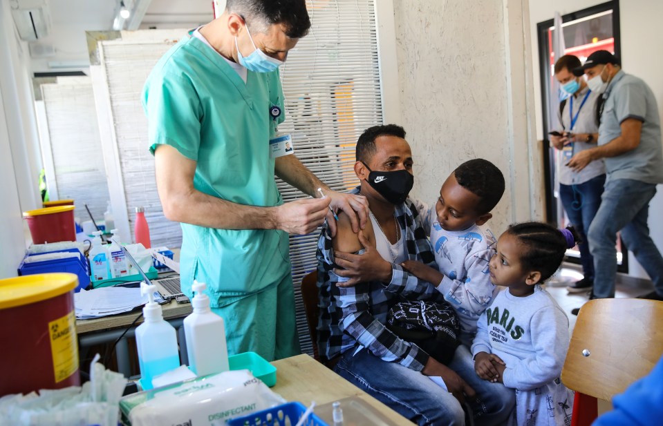 A man receives first dose of coronavirus (Covid-19) vaccination in Tel Aviv