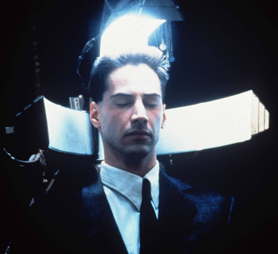 Keanu Reeves in Johnny Mnemonic - a courier who securely transports data with a chip in his head