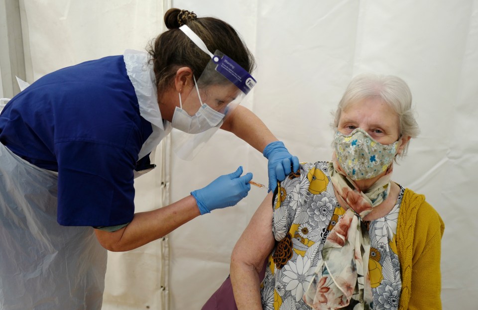 A woman is given the Oxford/AstraZeneca jab in Wadebridge