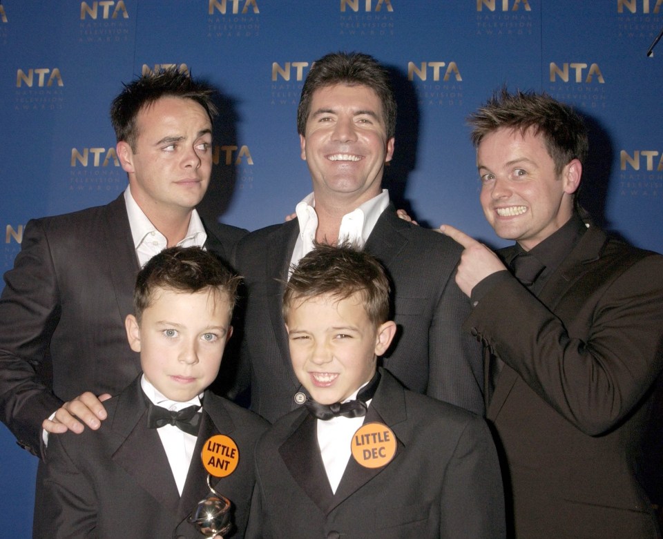 The pair with their 'big' counterparts and Simon Cowell at the NTAs in 2003