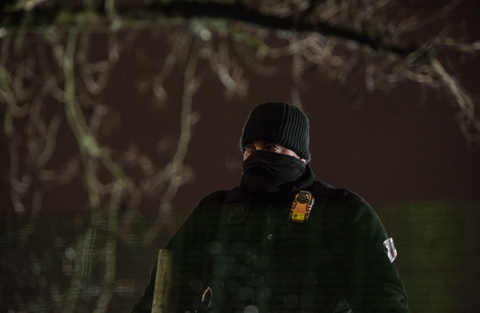 Security guards on duty at the protest late at night