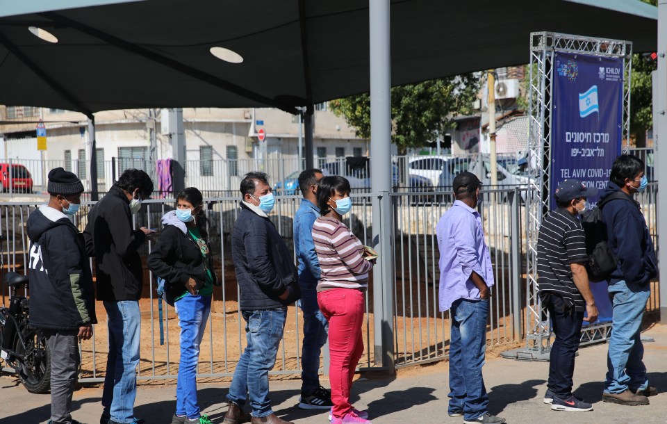 People wait in a queue to receive first dose of coronavirus (Covid-19) vaccination in Tel Aviv, Israel on February 10