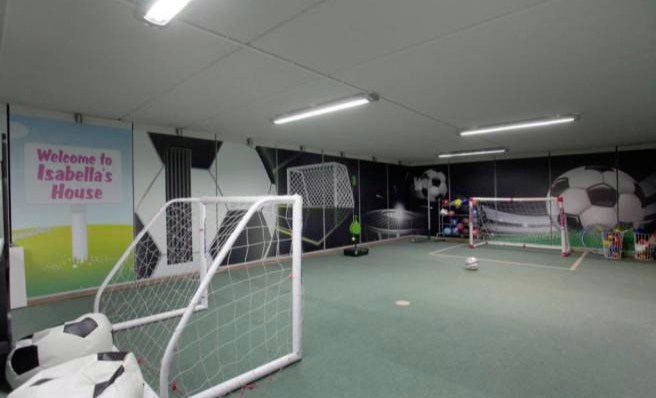 It has has a mini indoor football arena