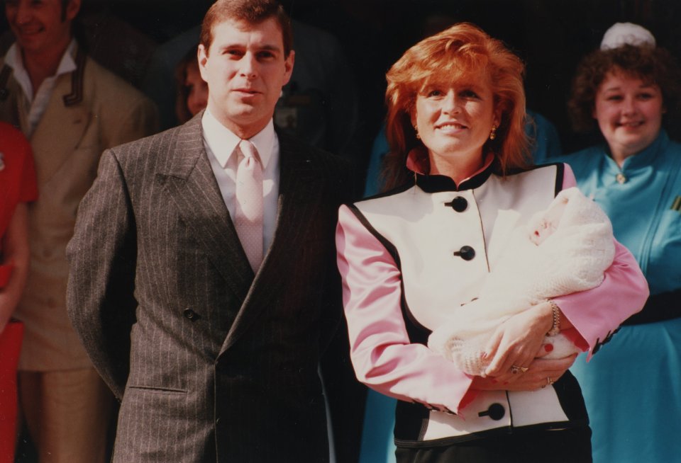 The Duke and Duchess of York, Prince Andrew and Sarah Ferguson, stand with Princess Eugenie after her birth at The Portland Hospital in 1990